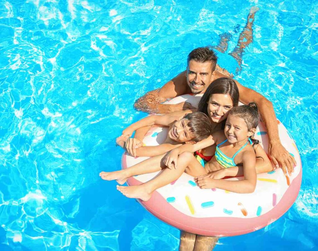 Happy family in pool. Maintaining a healthy pool environment.