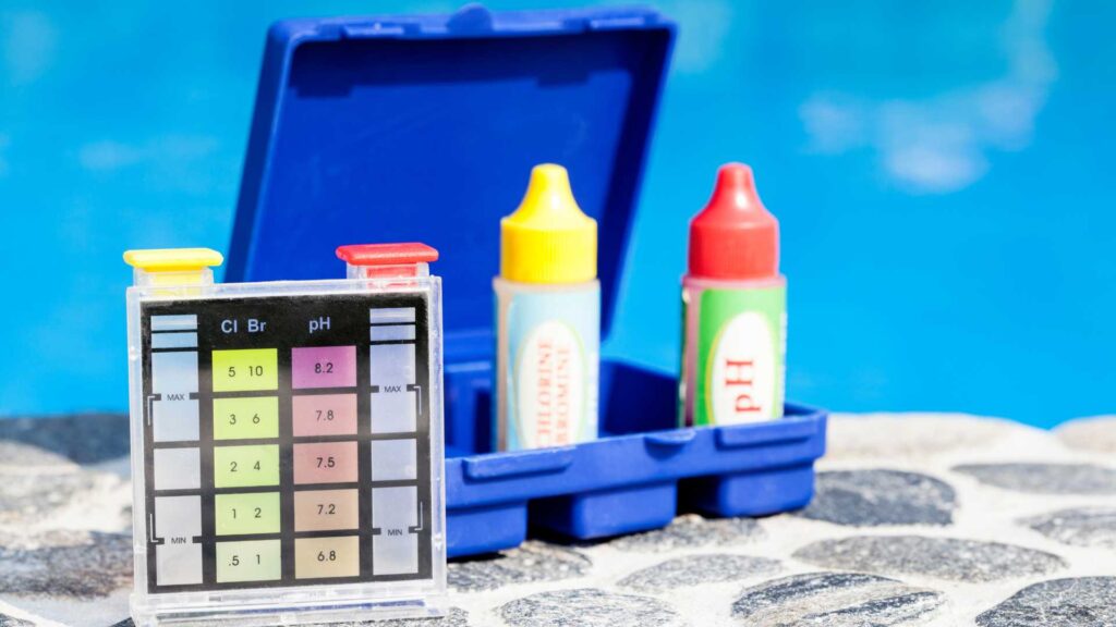 pH indicator next to swimming pool. The critical role of water chemistry in pool health.