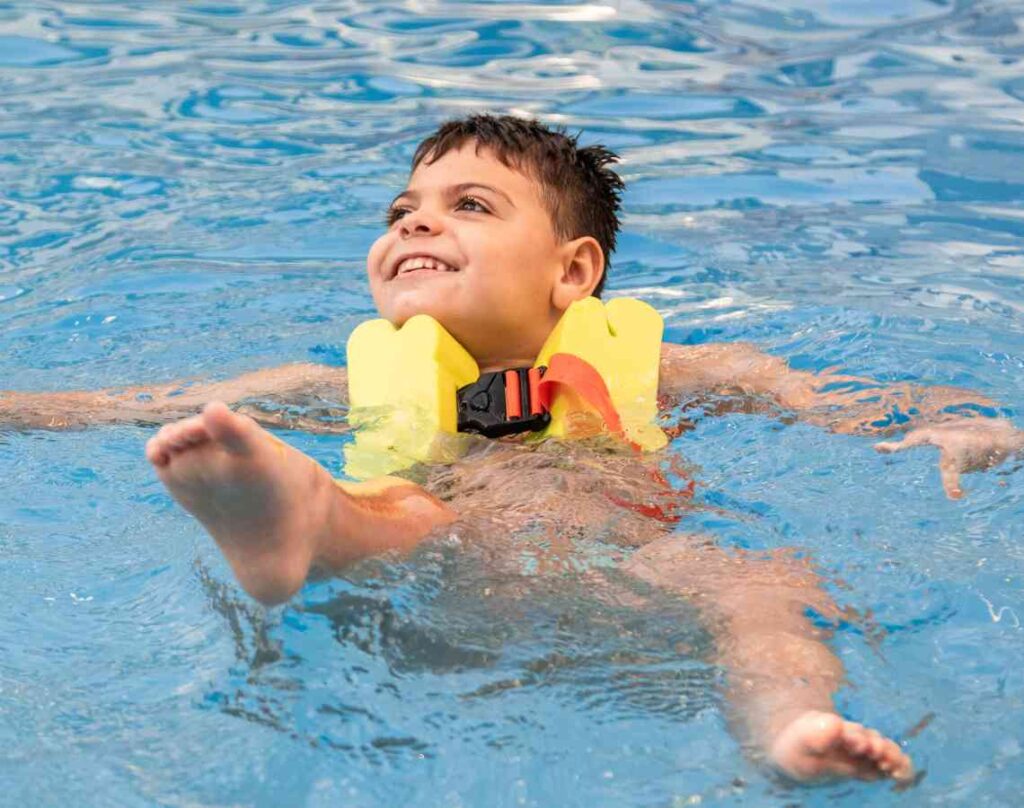 Child in pool with lifejacket. The hidden dangers in your pool.