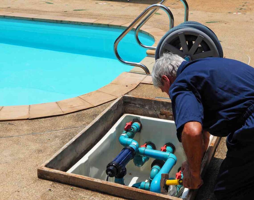 Person repairing pool. Preparing your pool for the swim season.