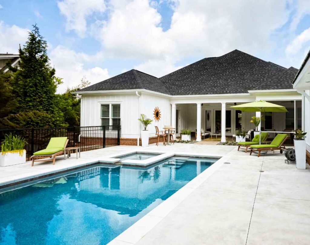 Built for the Real World: Why Energy-Efficient Pool Equipment Pays Off 1 White house with pool