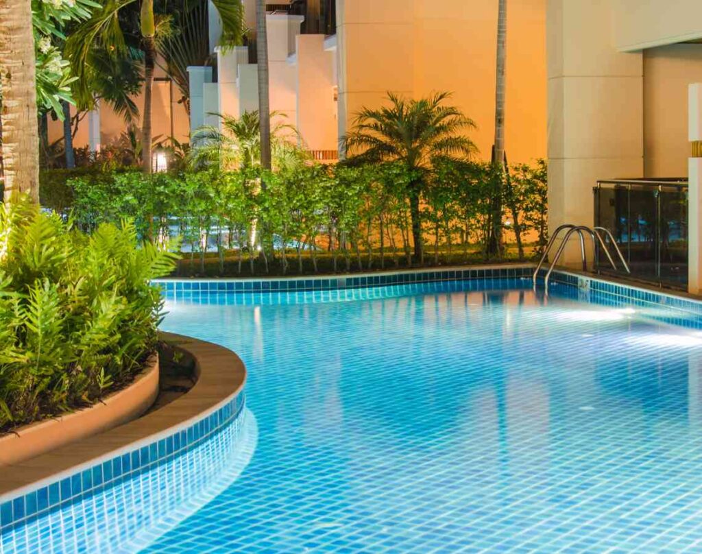 Pool surround by foliage. Preparing your pool for the swim season.
