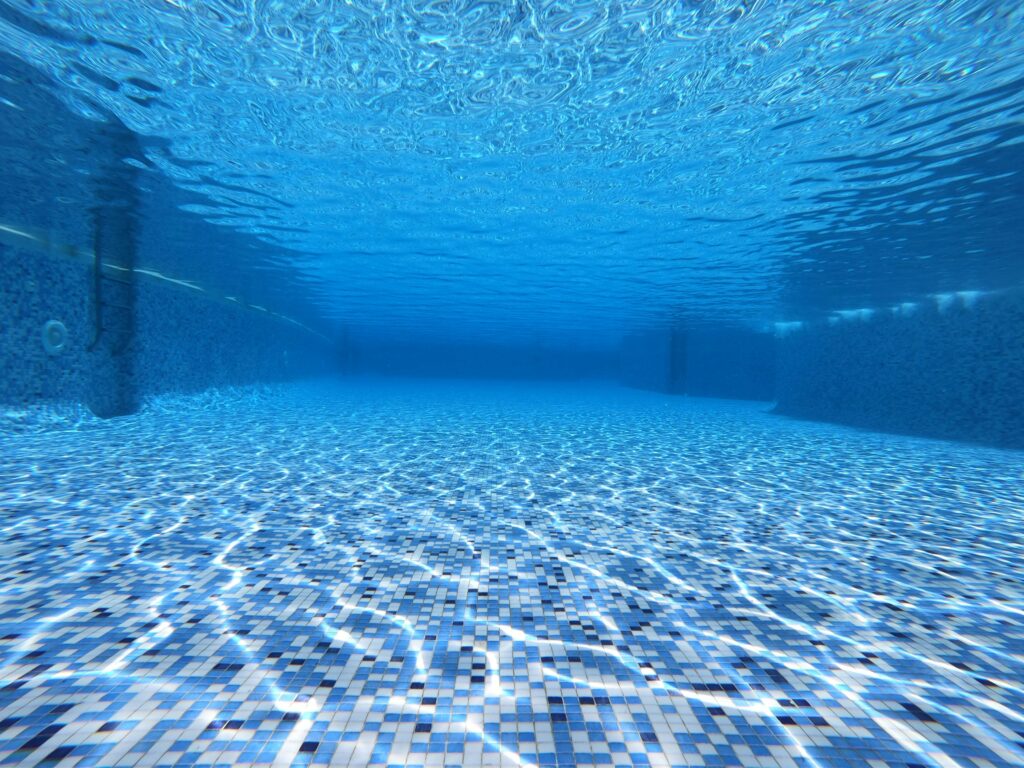 Underwater picture in pool. Cost-Effective Pool Maintenance.