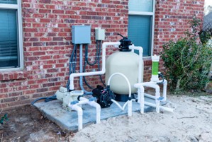 Sand vs. Cartridge Filters: Water Use Matters in Marin Pool Maintenance 3 Installed sand filter system outside a home